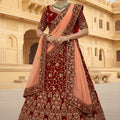 Fancy Maroon Velvet Embroidered Bridal Lehenga Choli with Heavy Zari Work and Peach Net Dupatta
