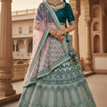 Stylish Mint Green Embroidered Bridal Lehenga Choli with Mirror Work and Net Dupatta