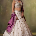 Stylish Beige Embroidered Tissue Lehenga Choli with Purple Dupatta for Wedding
