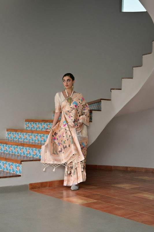 Pastel Peach Handwoven Silk Saree with Folk Art Motifs Floral Border