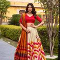 Superb Multicolor Tussar Silk Lehenga Choli with Printed Flared Skirt and Contrast Dupatta