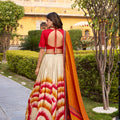 Superb Multicolor Tussar Silk Lehenga Choli with Printed Flared Skirt and Contrast Dupatta