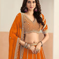 Stunning Orange Faux Georgette Embroidery Semi-Stitched Wedding Wear Lehenga Choli