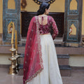 Elegant Magenta Cosmos Silk Embroidered Lehenga Choli with Ivory Flared Skirt