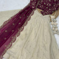 Elegant Magenta Cosmos Silk Embroidered Lehenga Choli with Ivory Flared Skirt