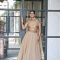 Wonderful Cream Fandy Silk Lehenga Choli with Heavy Embroidered Dupatta