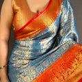 Sky Blue Kanchipuram Silk Saree With Rich Orange Zari Border Pallu