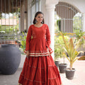 Impressive Rust Orange Cotton Designer Lehenga Choli with Layered Flared Skirt for Navratri