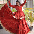Impressive Rust Orange Cotton Designer Lehenga Choli with Layered Flared Skirt for Navratri