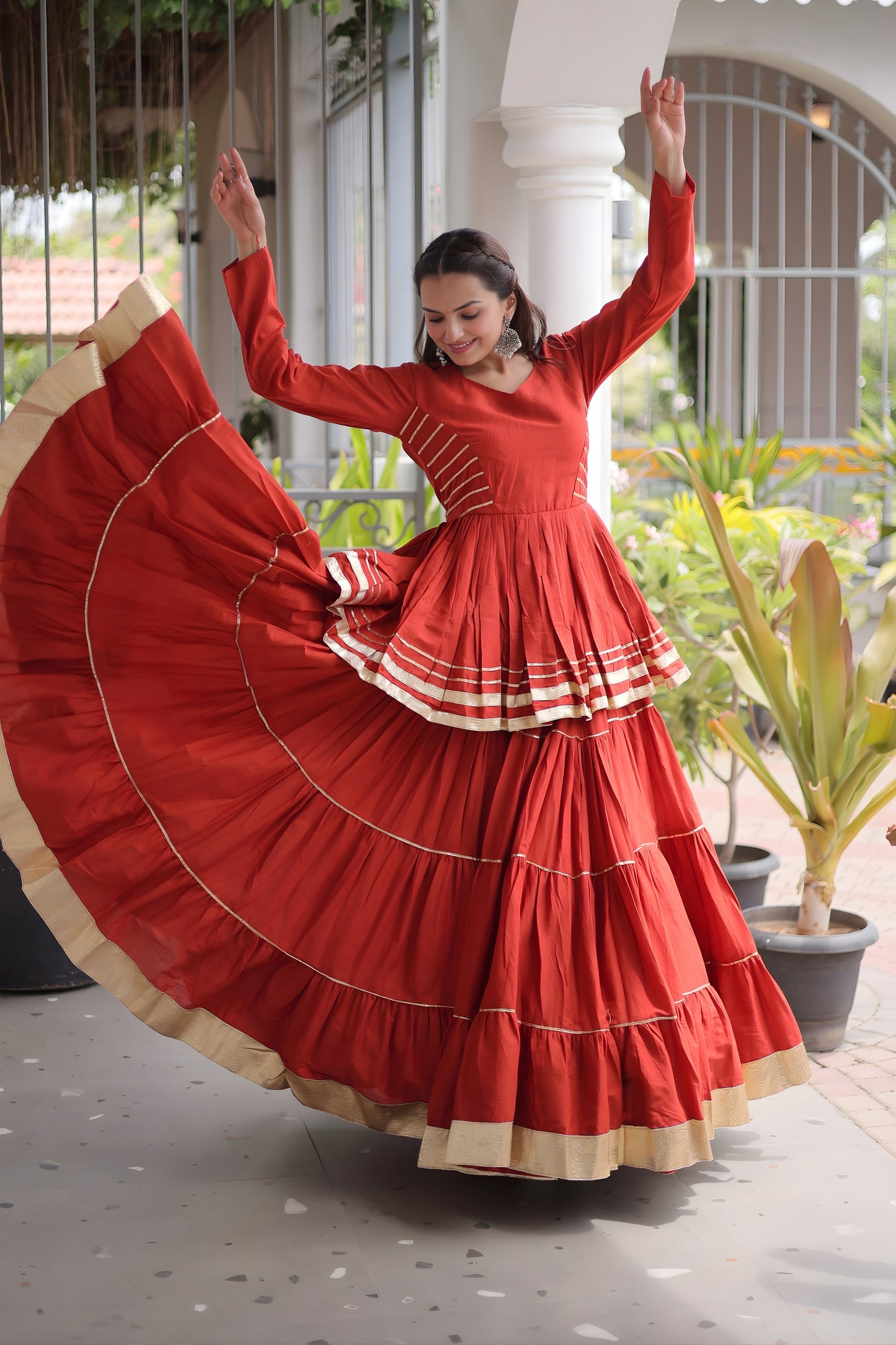Impressive Rust Orange Cotton Designer Lehenga Choli with Layered Flared Skirt for Navratri