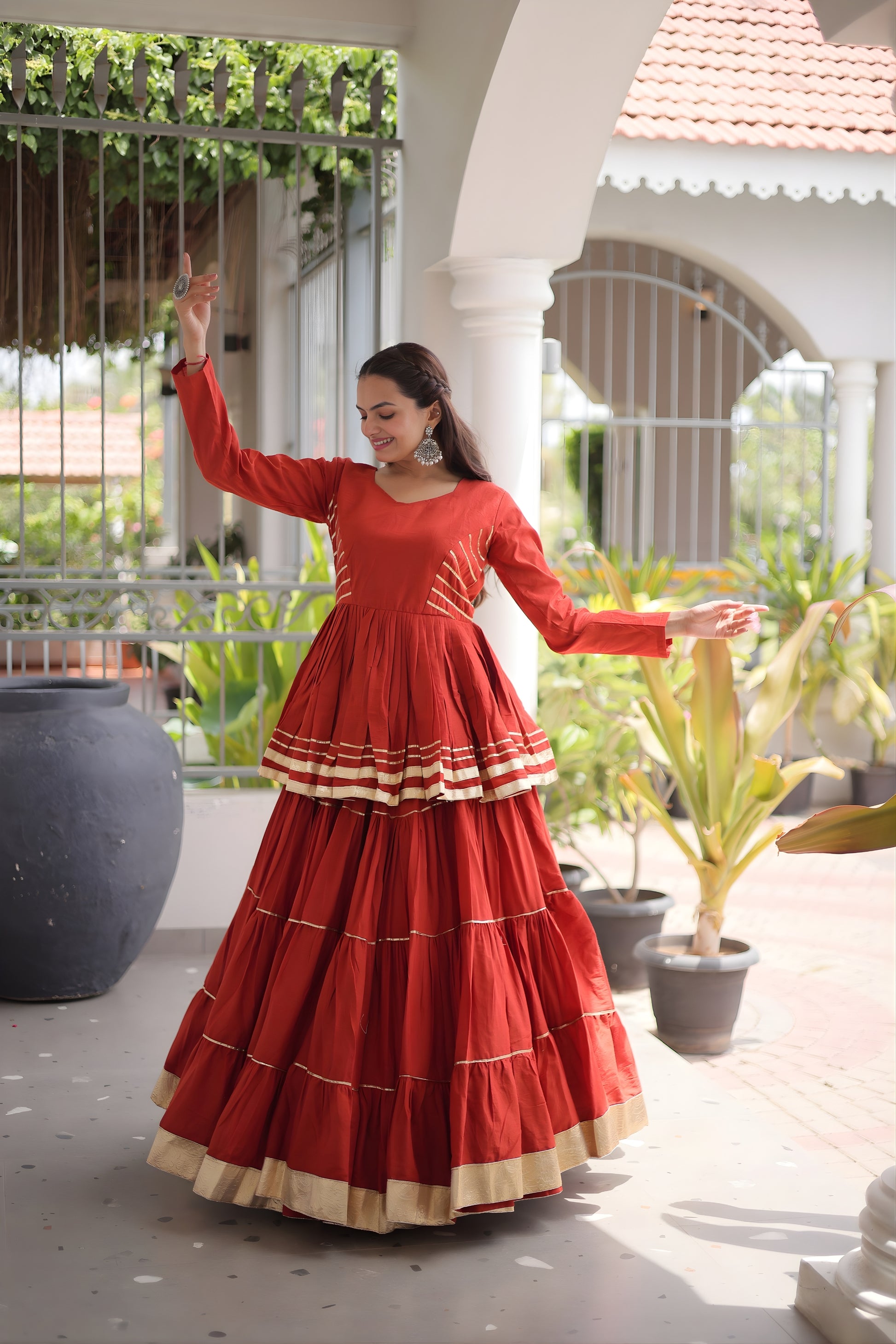 Impressive Rust Orange Cotton Designer Lehenga Choli with Layered Flared Skirt for Navratri