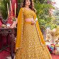 Luxury Mustard Yellow Faux Georgette Lehenga Choli with Heavy Embroidery Work and Matching Dupatta