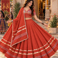 Glorious Rust Orange Roman Silk Designer Lehenga Choli with Kutchi Embroidery Work and Dupatta for Women