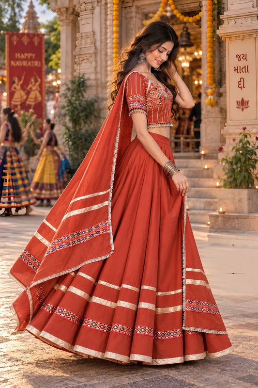Glorious Rust Orange Roman Silk Designer Lehenga Choli with Kutchi Embroidery Work and Dupatta for Women