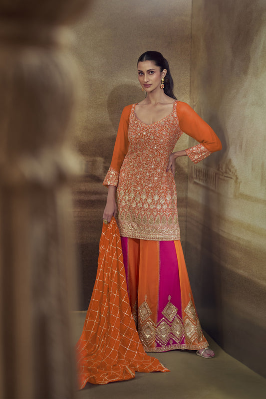 Gorgeous Orange and Rani Pink Georgette Heavy Embroidered Designer Salwar Suit with Dupatta