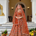 Exquisite Rust Orange Premium Silk Bridal Lehenga Choli with Heavy Embroidery Work and Dupatta