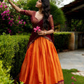 Captivating Orange and Maroon Kanchipuram Silk Designer Lehenga Choli with Gold Zari Weaving Work