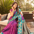 Magenta Silk Saree with Teal Green Contrast Border Floral Zari Work