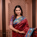 Rich Wine Red Paithani Silk Saree with Contrast Teal Blue Zari Border