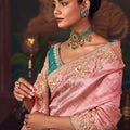 Pink Silk Saree with Embroidered Border and Teal Designer Blouse