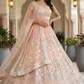 Wonderful Peach Embroidered Net Lehenga Choli with Dupatta for Wedding