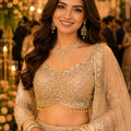 Elegant Beige Net Embroidered Bridal Lehenga Choli with Designer Dupatta for Wedding