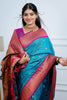 Teal Blue Kanjivaram Silk Saree with Pink Border Gold Zari Butti Work