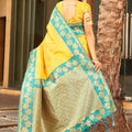 Yellow Silk Saree with Teal Green Contrast Border Floral Zari Work