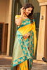 Yellow Silk Saree with Teal Green Contrast Border Floral Zari Work