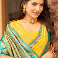 Yellow Silk Saree with Teal Green Contrast Border Floral Zari Work