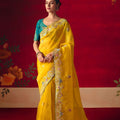 Yellow Floral Embroidered Silk Saree with Contrast Teal Blouse