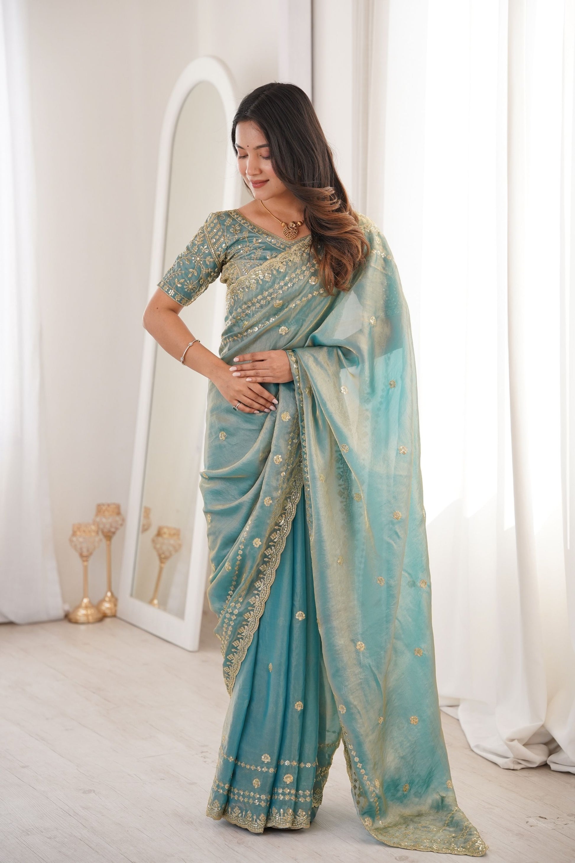Elegant Sky Blue Organza Silk Saree with Golden Embroidered Border