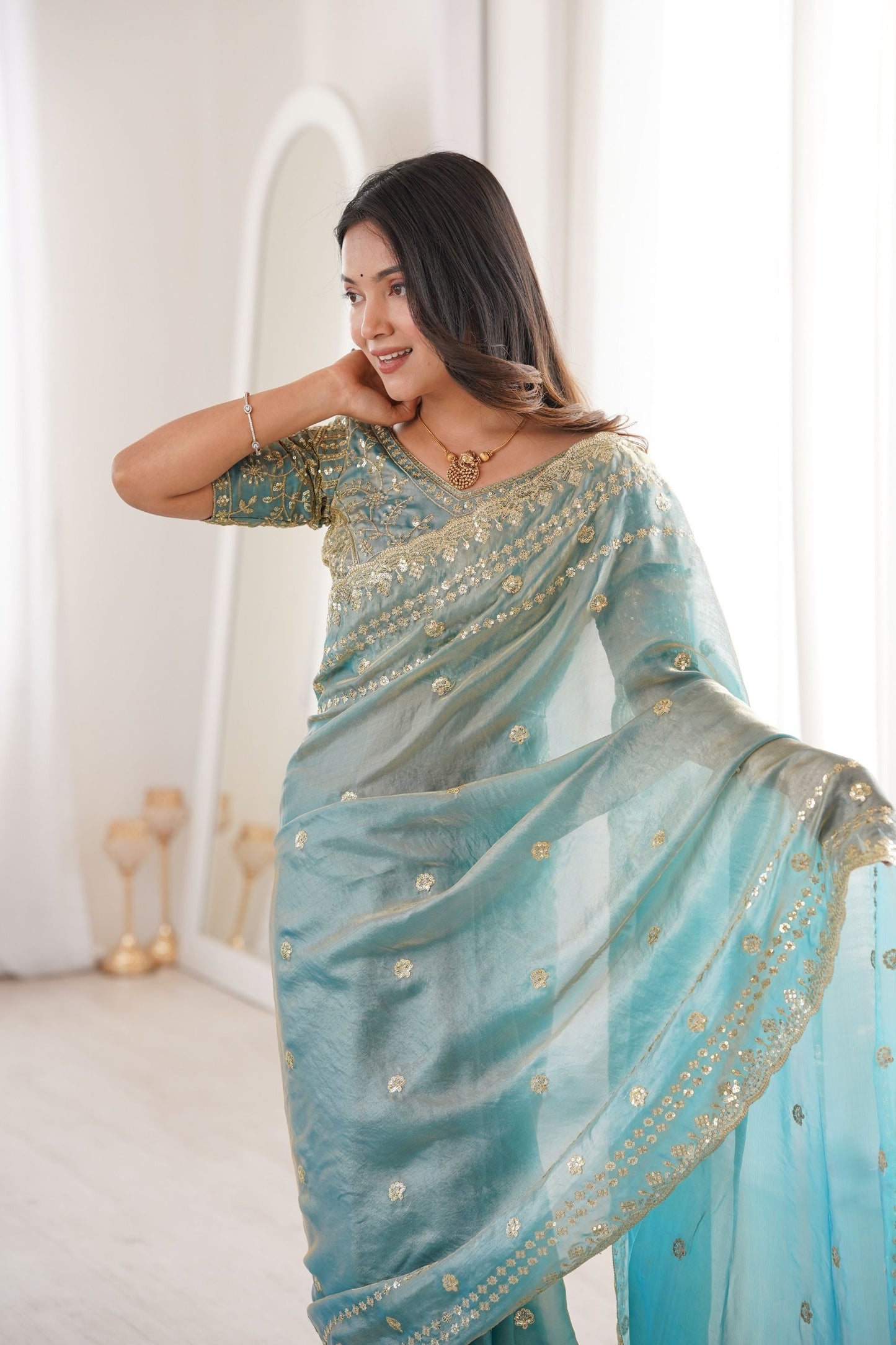Elegant Sky Blue Organza Silk Saree with Golden Embroidered Border