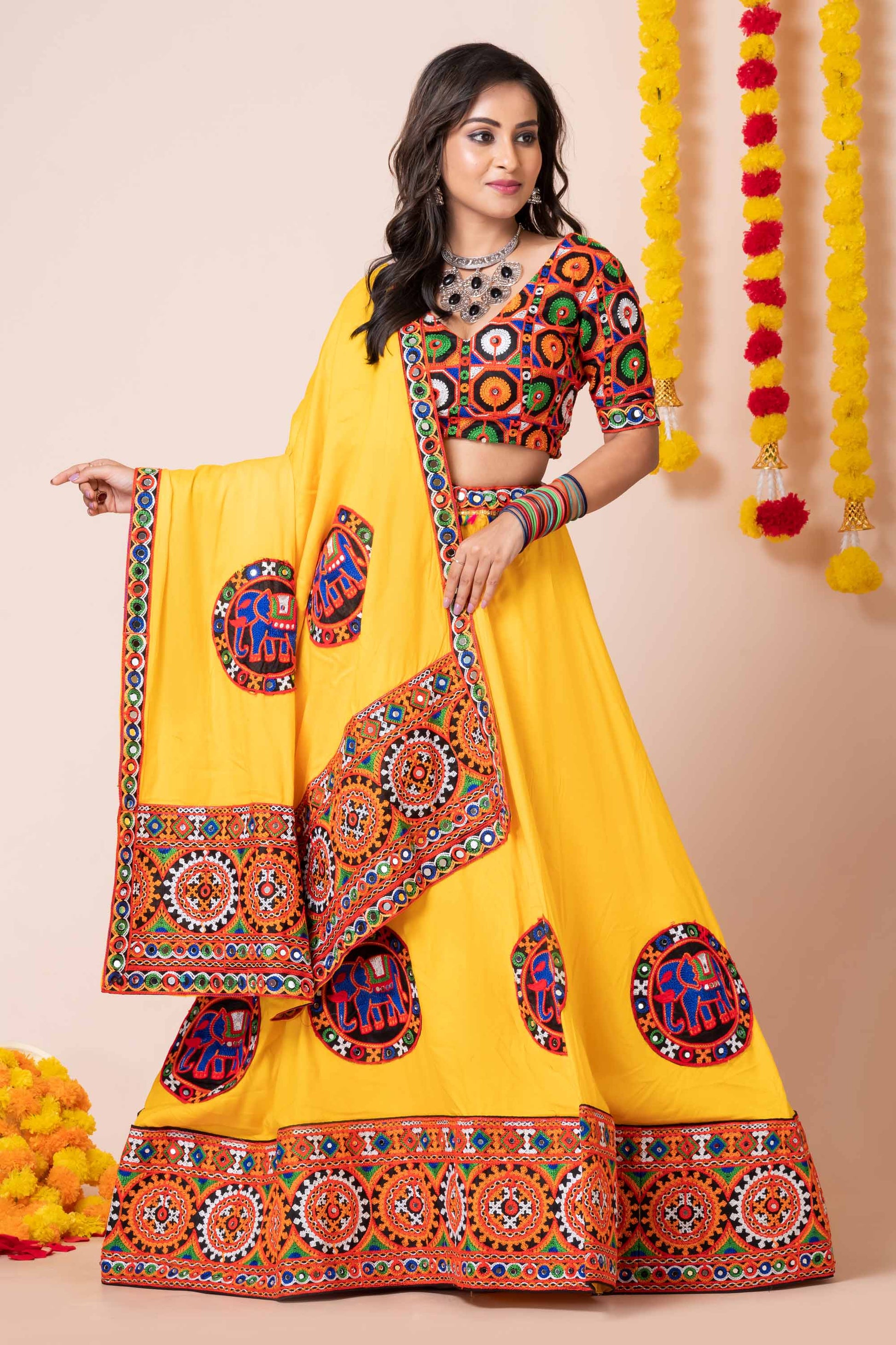 Yellow Navratri Lehenga Choli with Multicolor Mirror and Elephant Embroidery for Garba