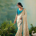  Cream Banarasi Silk Saree with Teal Blue Embroidered Blouse