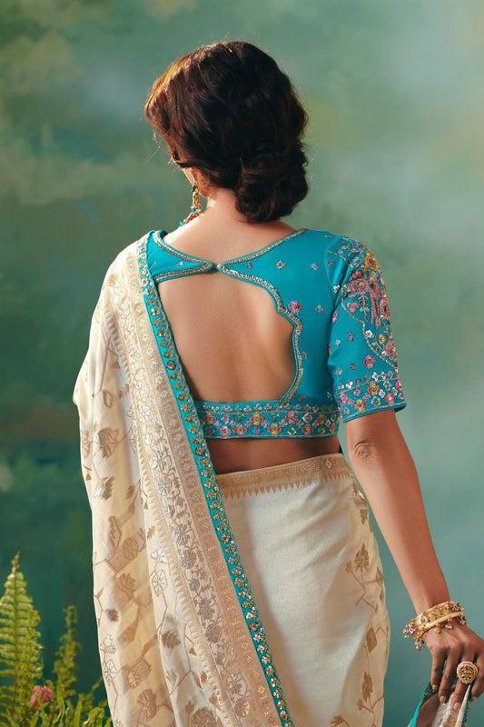 Cream Banarasi Silk Saree with Teal Blue Embroidered Blouse