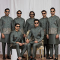 Invaluable Olive Green Art Silk Embroidered Wedding Kurta Pyjama with Jacket for Men