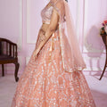 Stunning Peach Pink Sequins Embroidered Soft Net Lehenga Choli with Dupatta for Women