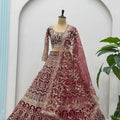 Luxurious Maroon Heavy Embroidered Butterfly Net Lehenga Choli with Dupatta