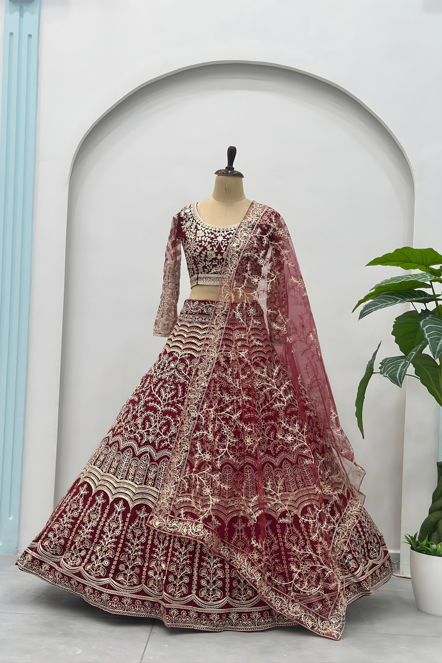 Luxurious Maroon Heavy Embroidered Butterfly Net Lehenga Choli with Dupatta
