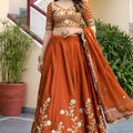 Awesome Rust Orange Rangoli Silk Lehenga Choli with Embroidery Work and Matching Dupatta