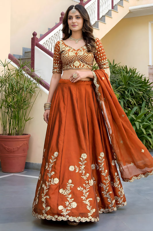 Awesome Rust Orange Rangoli Silk Lehenga Choli with Embroidery Work and Matching Dupatta