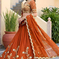 Awesome Rust Orange Rangoli Silk Lehenga Choli with Embroidery Work and Matching Dupatta