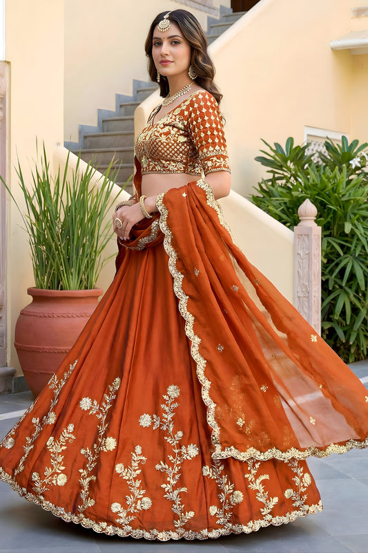 Awesome Rust Orange Rangoli Silk Lehenga Choli with Embroidery Work and Matching Dupatta
