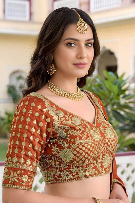 Awesome Rust Orange Rangoli Silk Lehenga Choli with Embroidery Work and Matching Dupatta