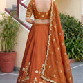 Awesome Rust Orange Rangoli Silk Lehenga Choli with Embroidery Work and Matching Dupatta