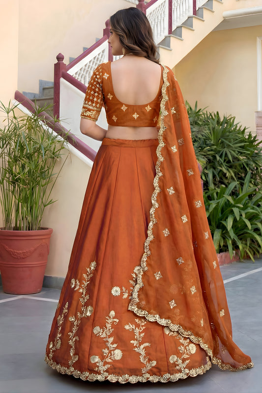 Awesome Rust Orange Rangoli Silk Lehenga Choli with Embroidery Work and Matching Dupatta