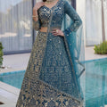 Luxury Teal Blue Butterfly Net Heavy Embroidered Bridal Lehenga Choli with Dupatta