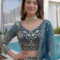 Luxury Teal Blue Butterfly Net Heavy Embroidered Bridal Lehenga Choli with Dupatta
