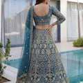 Luxury Teal Blue Butterfly Net Heavy Embroidered Bridal Lehenga Choli with Dupatta